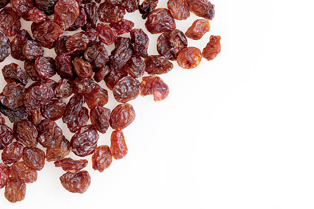 Raisins on White with Copy Space This Picture is made in my Daylight Studio.Photographed with Canon 5dmkII in RAW 16bit and Adobe RGB and professionally processed.Related images: raisin stock pictures, royalty-free photos & images