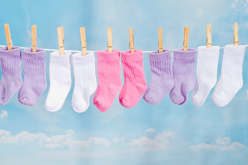 Baby Socks Hanging On A Clothesline