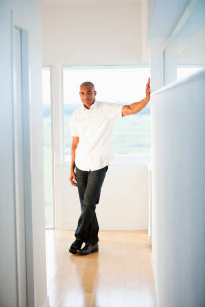 istock African American man standing indoors 184603866