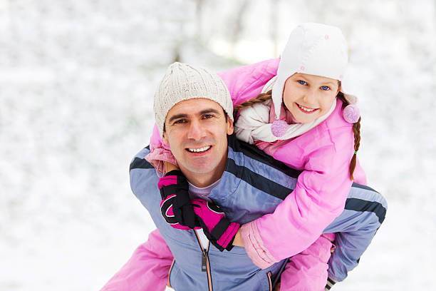 istock Father giving his daughter a piggyback ride. 184604056