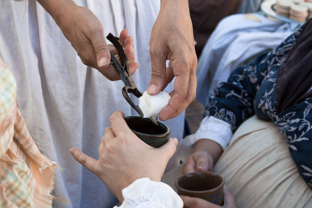 istock Cutting a Bit of Sugar For Hot Tea 184604366