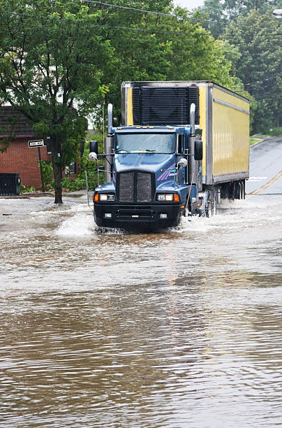 truck going through high water after a hurricane stock photo