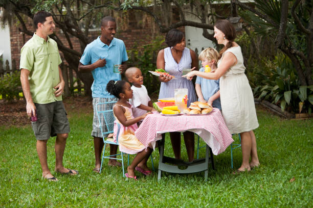 istock Two families at backyard cookout 184604627