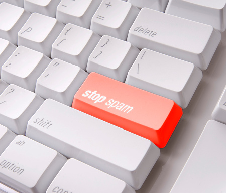 Red Stop Spam key on a computer keyboard 