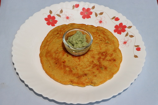 Besan pola, is a breakfast pancake prepared mostly in Maharashtra. The main ingredient are gram flour and tomatoes, green chilli, coriander leaves and spices