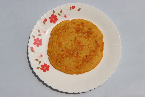 Besan pola, is a breakfast pancake prepared mostly in Maharashtra. The main ingredient are gram flour and tomatoes, green chilli, coriander leaves and spices