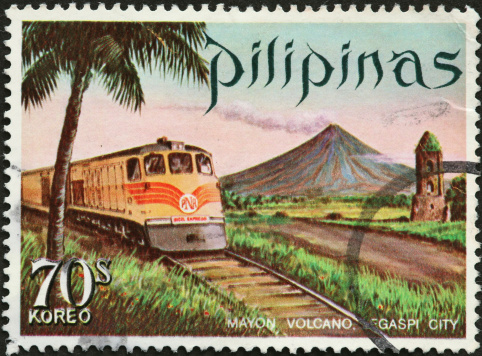 old train and volcano on a Philippine postage stamp