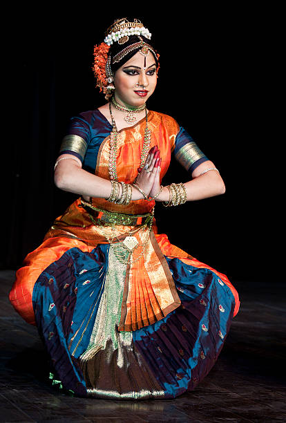 istock Young Indian woman dancing traditional dance. 184605702