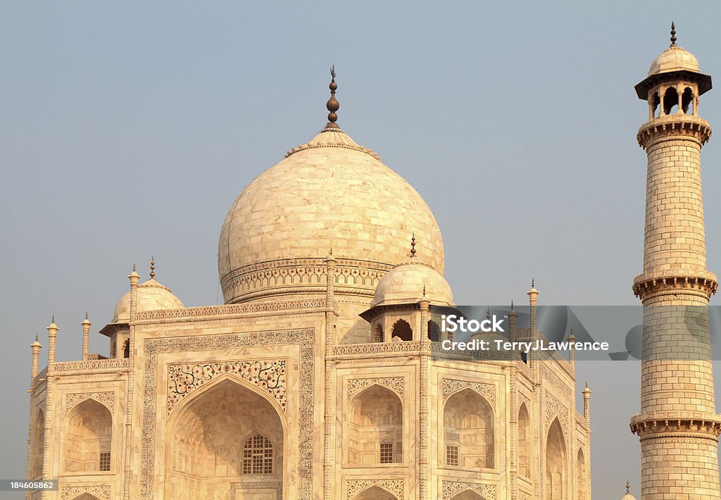Taj Mahal, Uttar Pradesh, India "Built by Shah Jahan as a mausoleum for his favourite wife, Arjumand Banu Begum (or Mumtaz Mahal aEElect of the Palaceaa), who died shortly after giving birth to her fourteenth child in 1631, work on the Taj Mahal began in 1632 and was completed in 1653.  Square in shape with arches in its sides, the Taj Mahal is built of fine white marble and sits on a square platform marked at each corner with a tall minaret.  Topped by a huge dome, the Taj Mahal is 55 metres high.   Overlooking the Yamuna River, and visible from the fort in the west, the Taj Mahal stands at the northern end of gardens enclosed by walls. Although its layout follows a distinctly Islamic theme, representing Paradise, it is above all a monument to love." Chhatri Stock Photo
