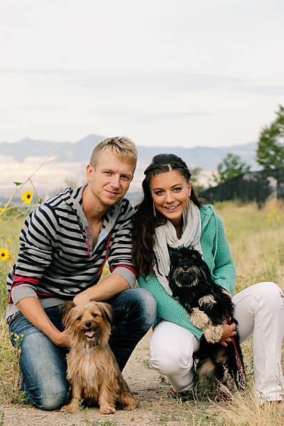 istock Happy Couple at the Dog Park Vertical 184605954
