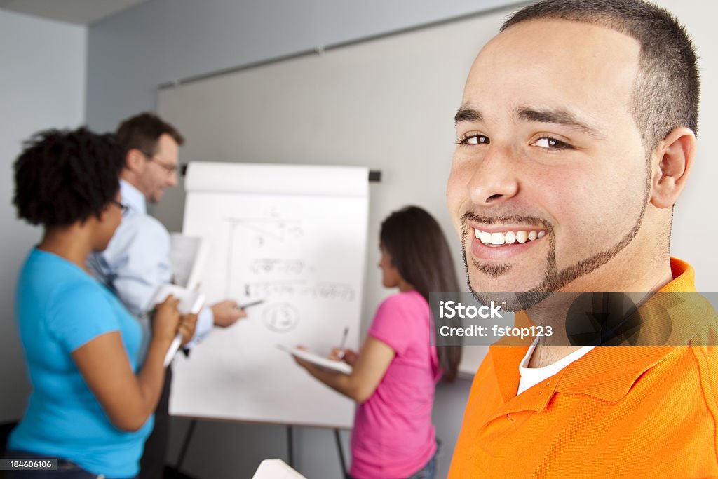 Students in calculus class with instructor Students in claculus class with instructor. Student looking at camera. Flipchart Stock Photo