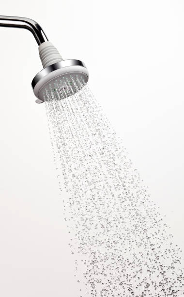 Shower head with water stop action Shower head with stop action water. Flash duration of 1/7000th of a second. You can see the bubbles in the water stream. One of a series. shower head stock pictures, royalty-free photos & images