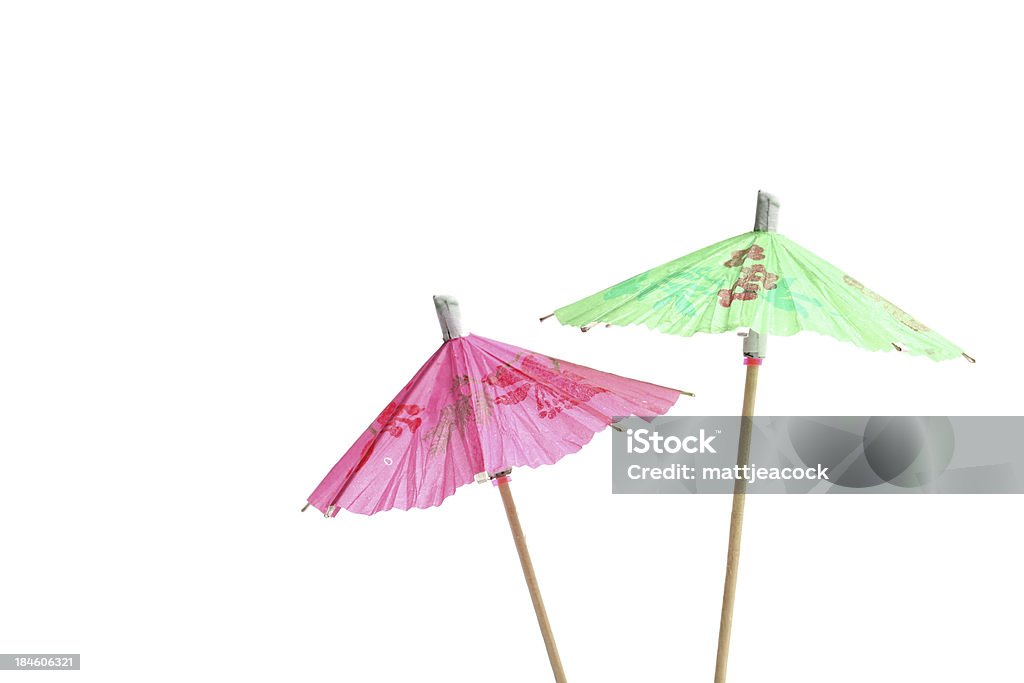 Verde y rosa el paraguas de cóctel - Foto de stock de Paraguas de cóctel libre de derechos