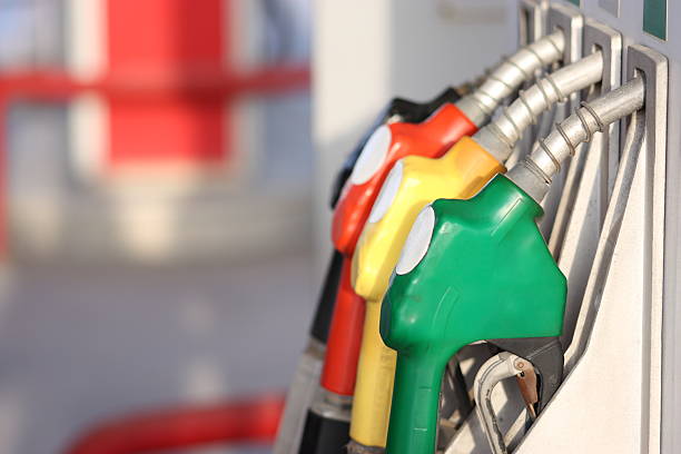 Different types of fuel pumps identified with colors Colorful petrol pumps. armored vehicle photos stock pictures, royalty-free photos & images