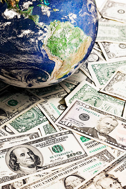 istock Satellite image of Earth rests on many US dollars 184606762