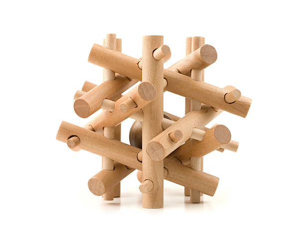 A wooden puzzle that interlocks stock photo