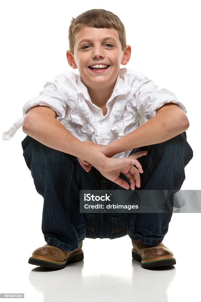 Happy Squatting Boy Portrait of a boy on a white background. http://s3.amazonaws.com/drbimages/m/jo.jpg 8-9 Years Stock Photo