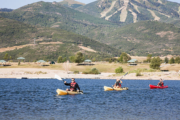 istock Kayakers kayaking on a lake with mountains around 184607261