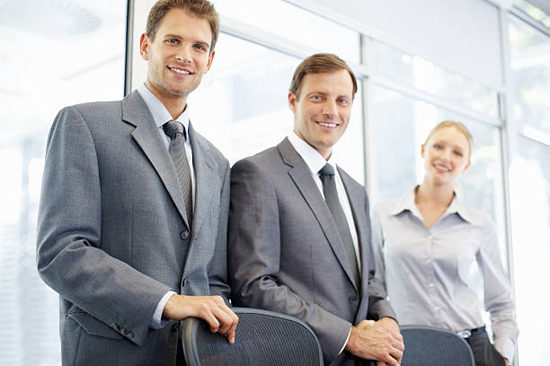 istock Successful business team of three standing in a row 184607506