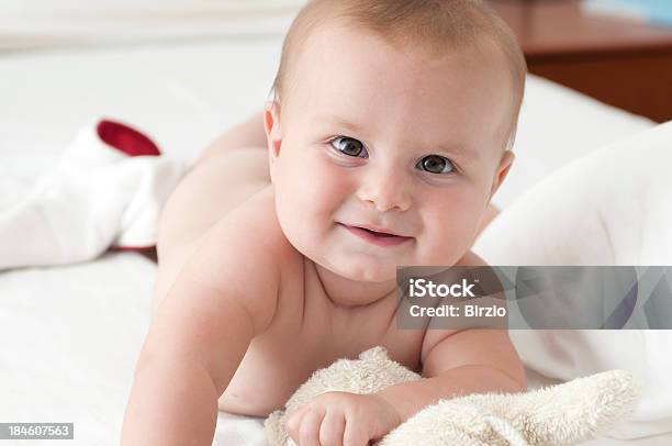 Smiling Babygirl Playing On The Bed Stock Photo - Download Image Now - Babies Only, Baby - Human Age, Baby Girls