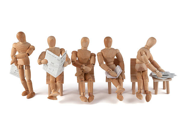 istock Wooden mannequins waiting... 184607621