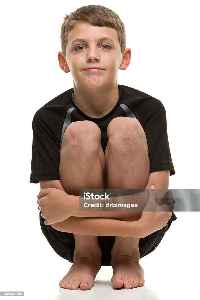 Squatting Boy Portrait of a boy on a white background. http://s3.amazonaws.com/drbimages/m/jo.jpg Barefoot Stock Photo