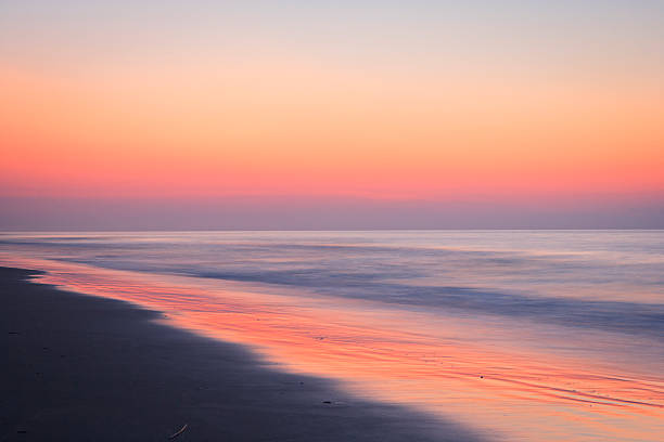 istock Pastel dawn over ocean waves before sunrise 184608487