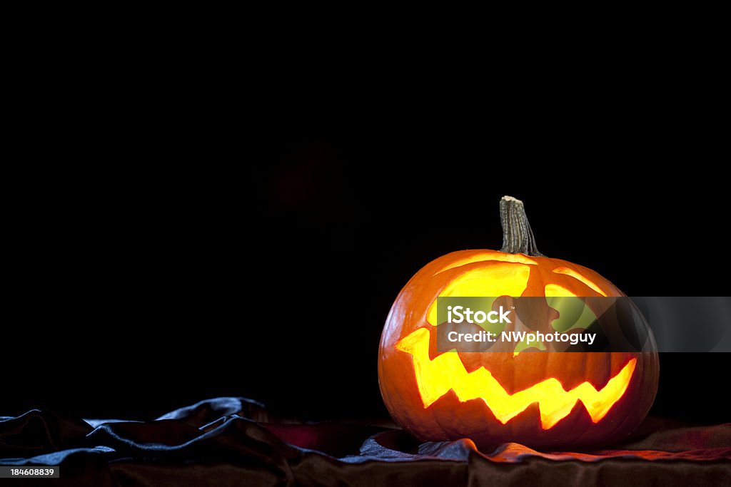 Halloween Pumpkin A glowing lack o'lantern on a black background.Click here to view my Halloween lightbox Autumn Stock Photo