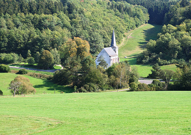 istock Small church in green valley 184609032