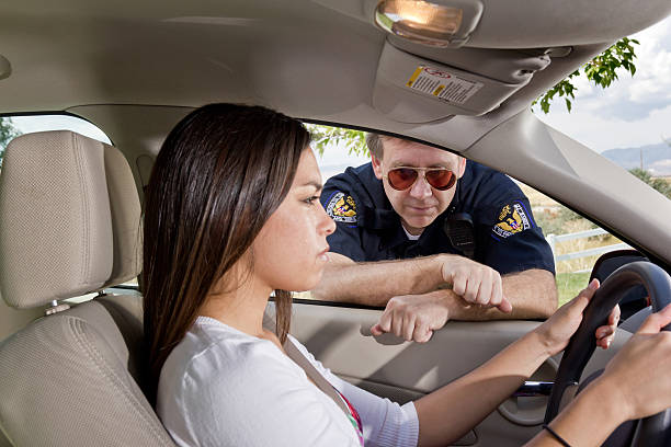 istock Young Woman Stopped by Officer with Tears 184609041