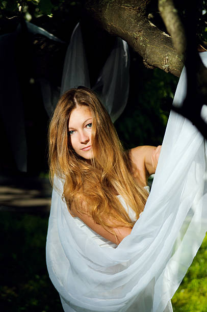 istock Teenage girl under tree 184609075