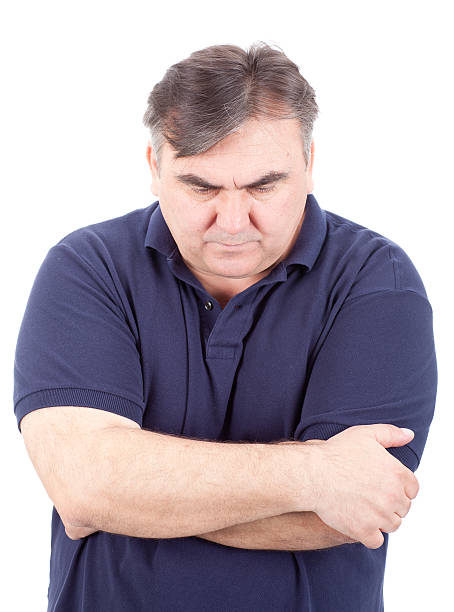 Mature man in deep thought isolated on white stock photo