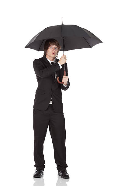 istock Businessman holding an umbrella 184609483