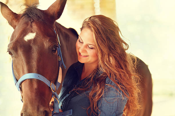 istock woman together with her horse 184609519
