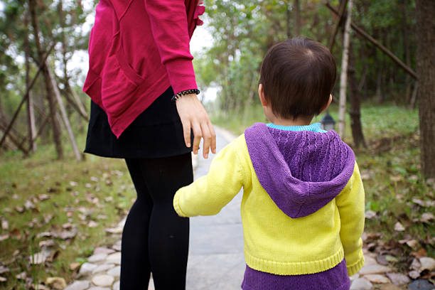 istock Cute baby playing with mother 184609649