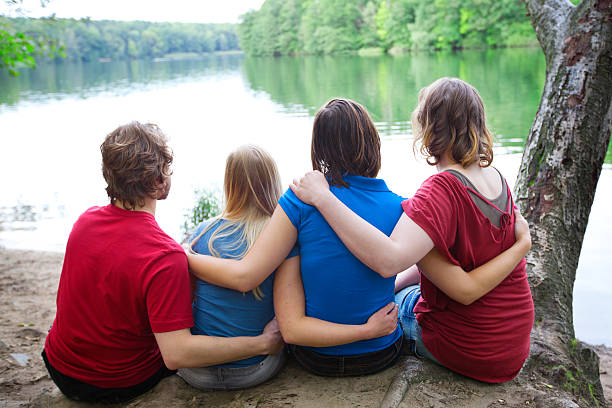 istock Friends hugging in the forest 184609753