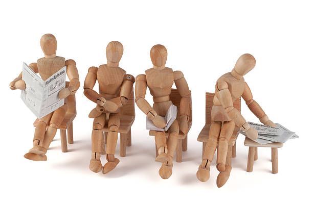 istock Wooden mannequins waiting... 184610123