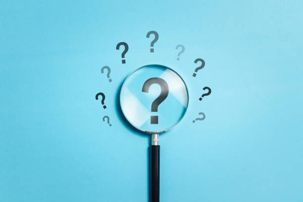 istock Question marks concept. Magnifying glass choos question mark for confusion, faq, ask, question or solution. 1846102023