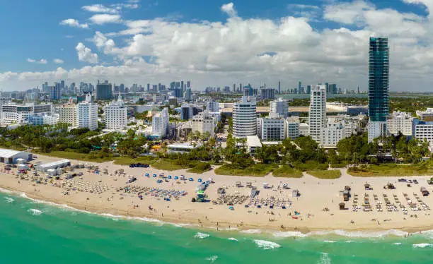 Photo of Popular vacation spot in the United States. Ocean warm waters and sandy beachfront at Miami Beach in Florida, USA. American travel destination