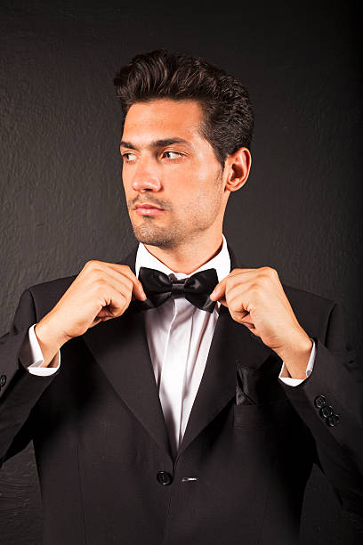 150+ Man In A Tux Fixing His Cufflink Stock Photos, Pictures & Royalty ...