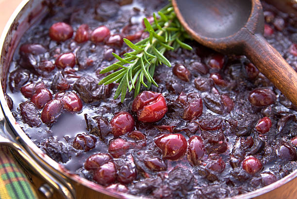 Cooking holiday dinner cranberry sauce: Fresh rosemary & cranberries. (SEE LIGHTBOXES BELOW for more Thanksigivng, Christmas cooking & food backgrounds...)