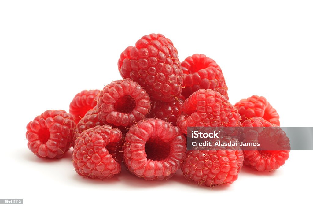 Bunch of raspberries on white background Raspberries freshly picked from the garden, isolated on a white background. Raspberry Stock Photo