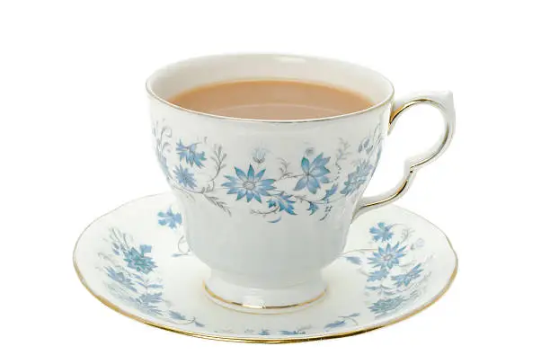 Photo of Hot tea served in a bone china cup and saucer