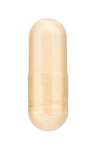 Ginseng Capsule on white