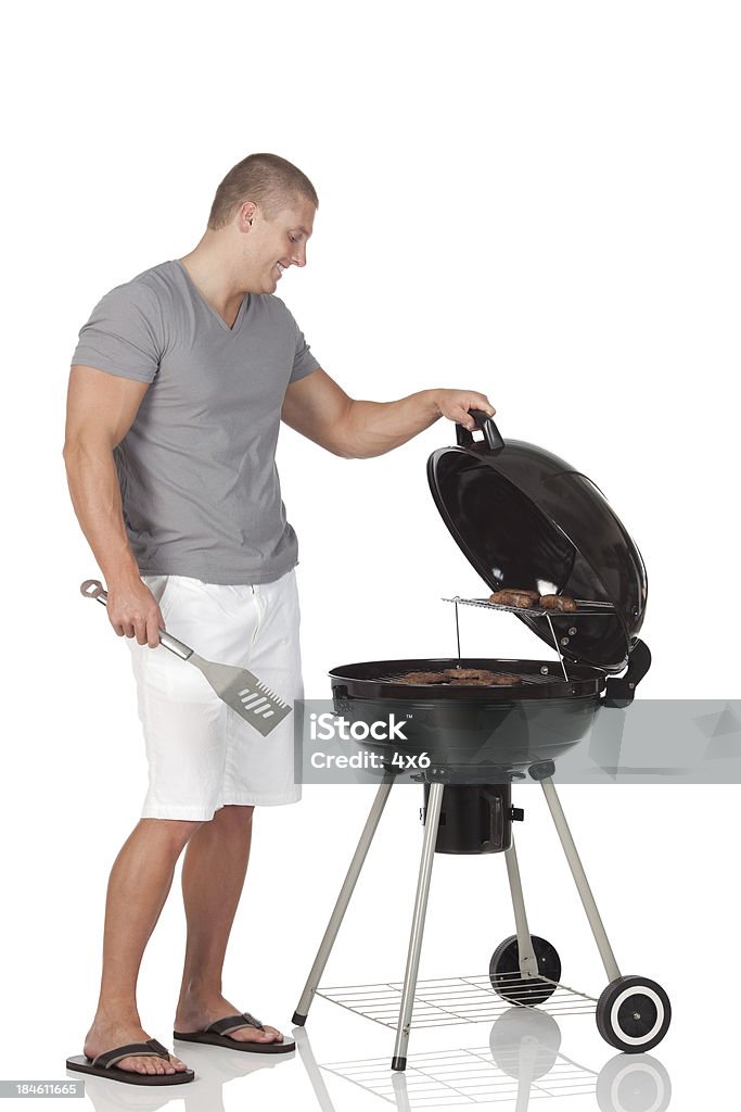 Man preparing food Barbecue - Meal Stock Photo