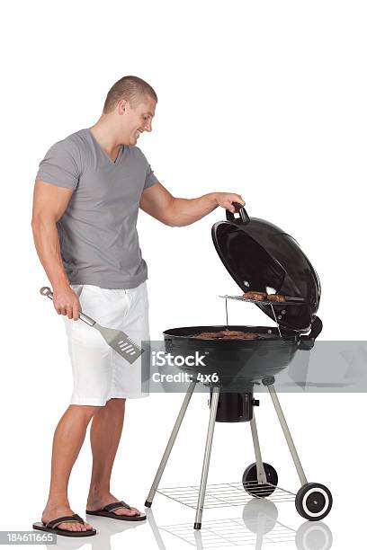 Man Preparing Food Stock Photo - Download Image Now - Barbecue - Meal, White Background, 20-29 Years