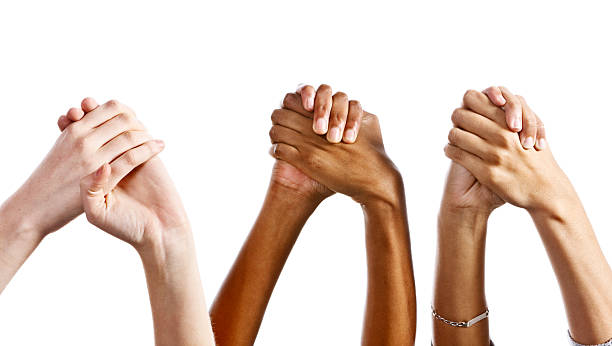 istock Three mixed pairs of clasped hands against white background 184611862