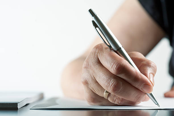 istock Woman writing in office 184611914