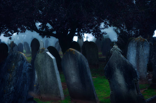 istock Moonlight Shines Over Dark Misty Cemetery Tombstones 184612123