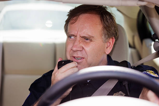 istock Police Officer in a Car 184612187